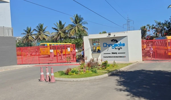 The secure campus perimeter and landscaped entrance of Chrysalis High Marq, located in the immediate vicinity of Sobha Hoskote in Hoskote