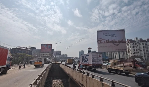Wide angle view of the highway approach road leading towards the Sobha Hoskote project site showcasing the expansive infrastructure and connectivity