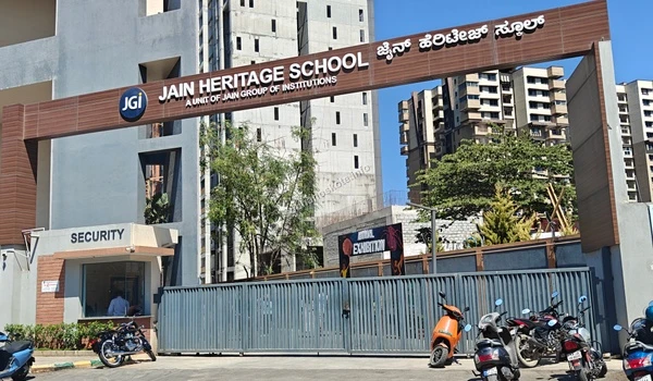 The grand entrance arch of Jain Heritage School by JGI Group featuring a secure gated campus and modern architecture near Sobha Hoskote