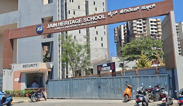 The grand entrance archway of Jain Heritage School by JGI Group featuring a modern academic campus near Sobha Hoskote