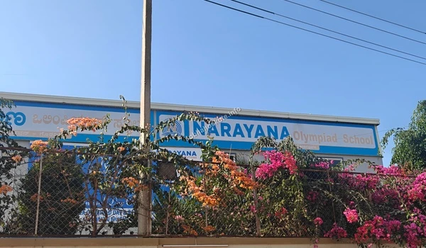 The secure perimeter and decorative landscaping surrounding Narayana Olympiad School, situated conveniently for families residing at Sobha Hoskote