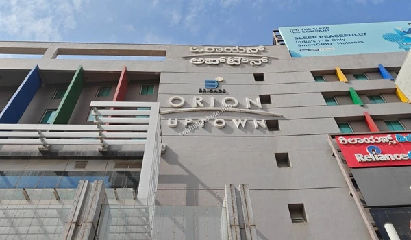 The main entrance signage of Orion Uptown Mall highlighting the premium shopping destination located conveniently for Sobha Hoskote homeowners