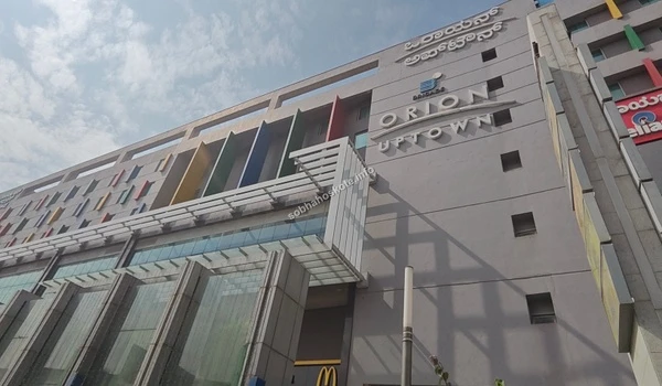 A grand view of the Orion Uptown Mall architectural facade and entrance providing premium lifestyle options for Sobha Hoskote residents