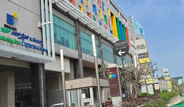 Side view of the Orion Uptown Mall complex showcasing its massive scale and proximity to the Sobha Hoskote residential project