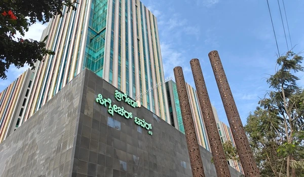 Low angle architectural view of the colorful glass fins and modern facade of Brigade Signature Towers near Sobha Hoskote