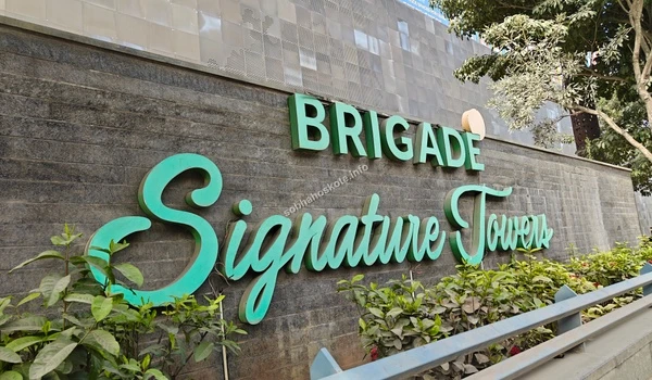 Close-up of the official Brigade Signature Towers building signage located at the entrance near Sobha Hoskote