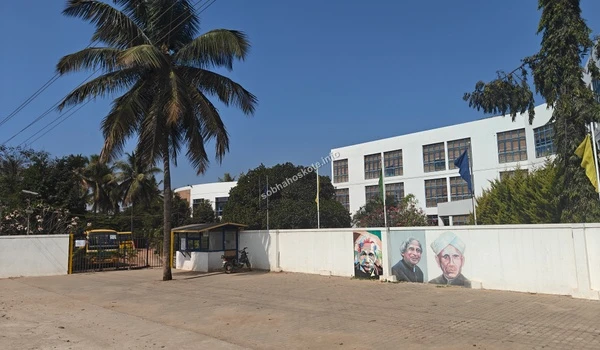 The artistic boundary wall of Capstone High School featuring portraits of leaders near Sobha Hoskote