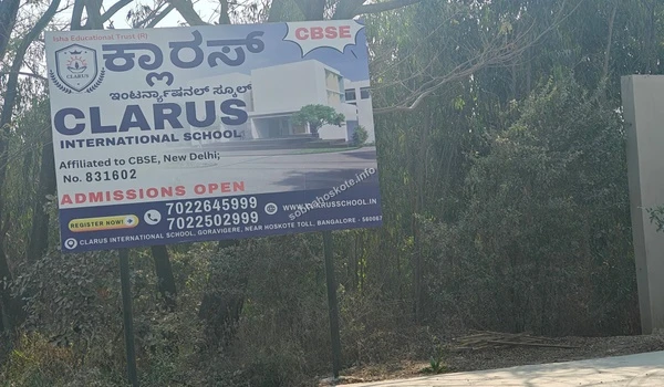 Clarus International School admission open board displaying contact details for residents of Sobha Hoskote