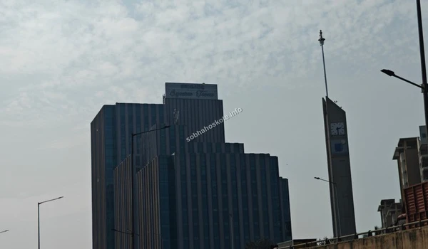 Zoomed-in shot of the top facade of the commercial towers indicating the business district near Sobha Hoskote