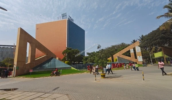 View of the tech park gate area with pedestrians walking, showcasing the safe and accessible environment near Sobha Hoskote