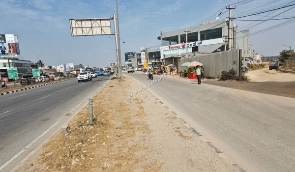 The wide paved access point leading from the high-traffic main road directly into the Sobha Hoskote project area for seamless commuting