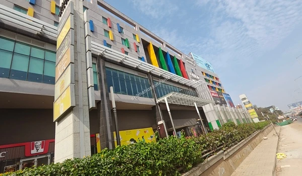 Modern exterior architecture of the shopping mall featuring colorful facade designs near Sobha Hoskote