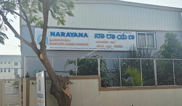 Close up view of the Narayana Olympiad School signage and campus gate providing education access for Sobha Hoskote residents