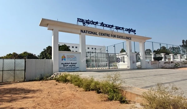 Daylight front view of the National Centre For Excellence gates and security post near Sobha Hoskote Bangalore