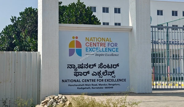 Official signage of National Centre For Excellence on the main archway near the Sobha Hoskote development