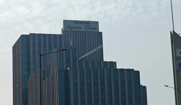 View of the upper floors of Brigade Signature Towers against the skyline, a major landmark near Sobha Hoskote
