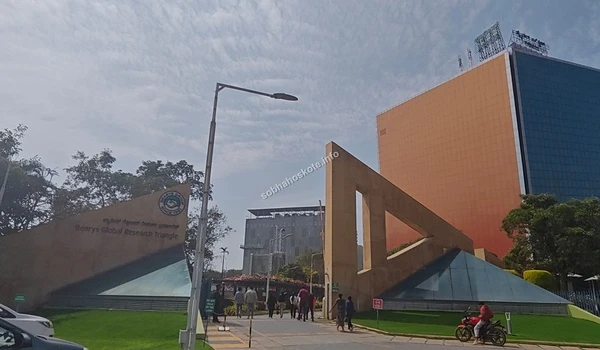 Busy morning scene at the nearby workplace entrance highlighting the vibrant professional environment close to Sobha Hoskote