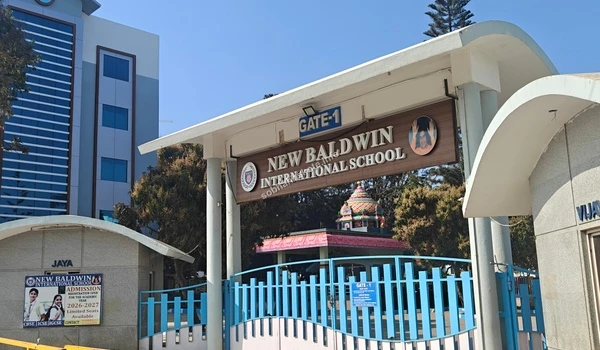 Street side facade and security post of New Baldwin International School offering safety and convenience for Sobha Hoskote residents