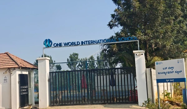 Street side perspective of the One World International School entrance providing top-tier schooling options for Sobha Hoskote residents