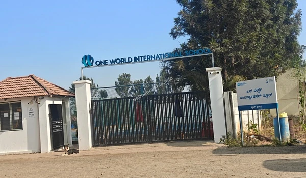 The main entrance and security gate of One World International School providing global education standards near Sobha Hoskote