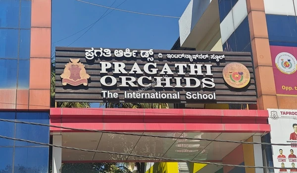 Close up view of the Pragathi Orchids The International School main board near Sobha Hoskote site