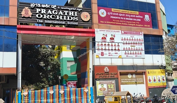 View of the colorful entrance gate and security area of Pragathi Orchids near Sobha Hoskote
