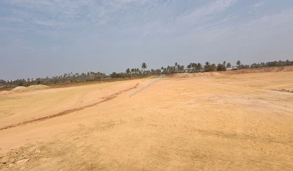 View of the construction area at Sobha Hoskote featuring temporary site hoardings and preliminary land grading for the residential blocks