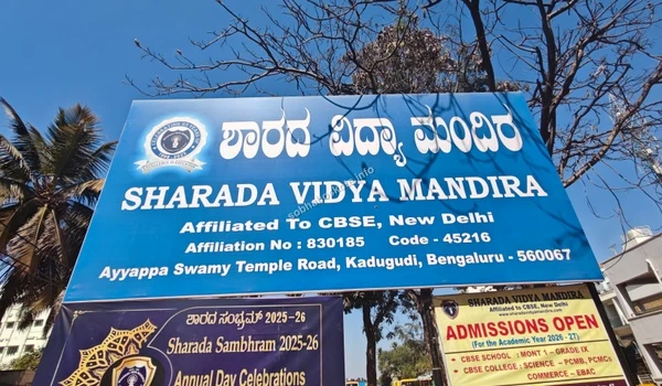 The prominent blue signage of Sharada Vidya Mandira near Sobha Hoskote showcasing their CBSE affiliation and wide range of academic streams