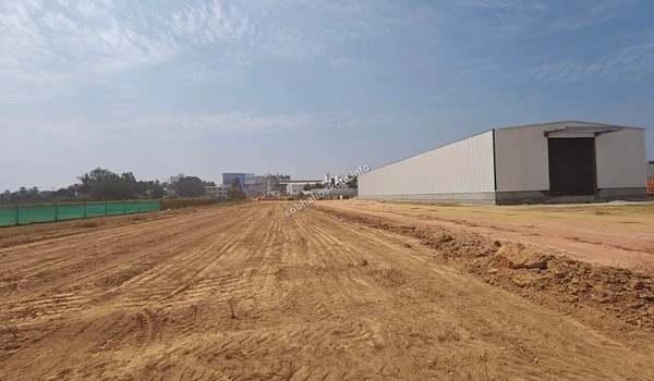Exterior of the large industrial-style site office and warehouse building located at the Sobha Hoskote construction area