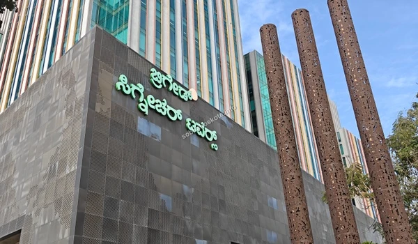 Street level view showing the road connectivity and traffic flow in front of the commercial towers near Sobha Hoskote
