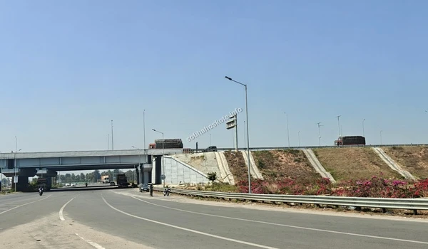 Detailed view of the strategic STRR overbridge and underpass infrastructure providing excellent traffic connectivity to Sobha Hoskote