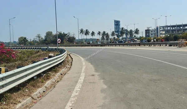 Wide view of the Satellite Town Ring Road (STRR) infrastructure near Sobha Hoskote, showcasing the high-quality road connectivity in the region