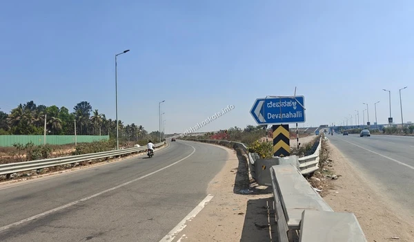 Detailed view of the safety barriers and modern expressway design along the STRR towards Devanahalli near the Sobha Hoskote project site