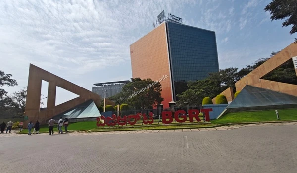 View of the main entrance to Bearys Global Research Triangle tech park featuring large signage and modern office buildings near Sobha Hoskote